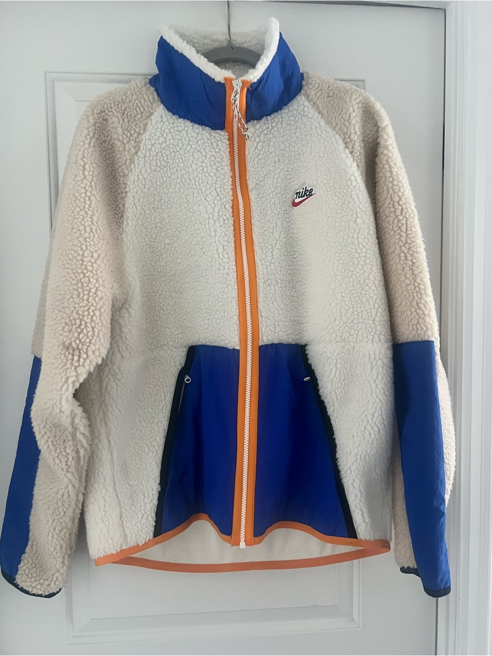 Nike Cream Sherpa Jacket with Blue Panels and Orange Trim